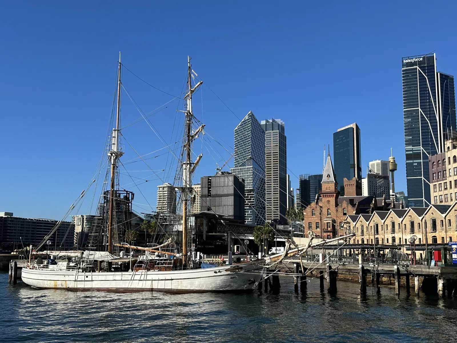 Sydney harbour waterfront with tall ship and skyline