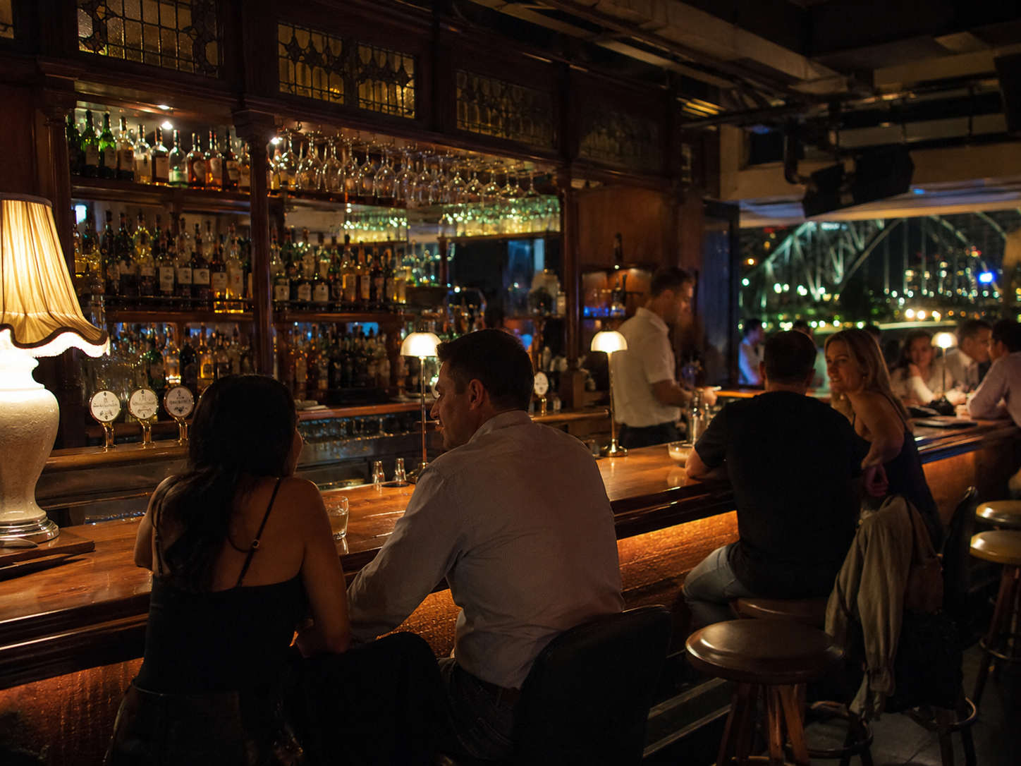 Cozy Sydney harbour-view cocktail bar at night