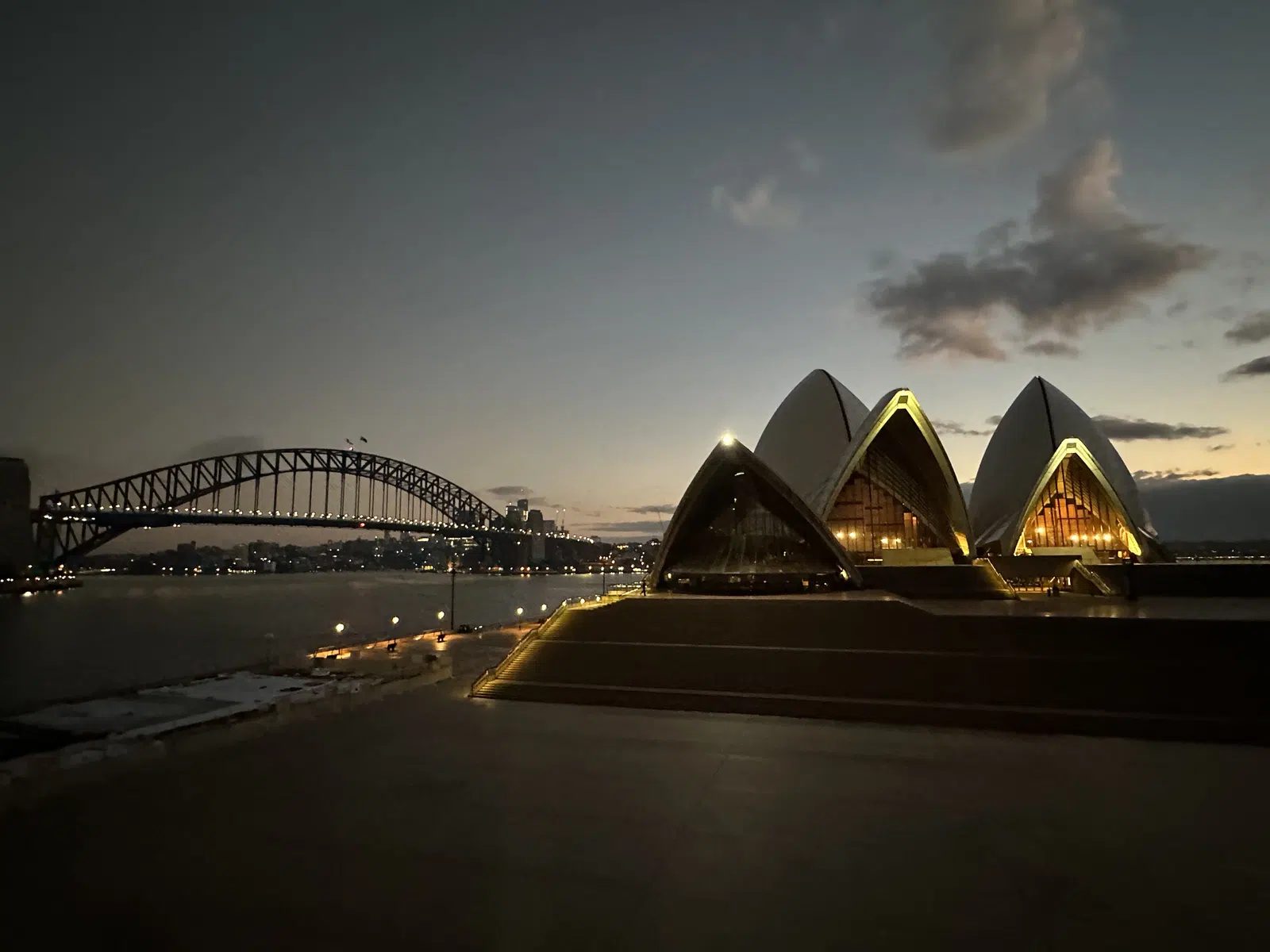 Sydney Opera House at golden dusk from the harbour